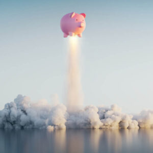piggy bank taking off like a rocket
